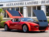 a red sports car parked in front of a building