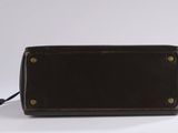 brown leather purse on white background with clipping for cord