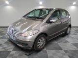 a picture of a silver mercedes b - class parked on a checkered floor
