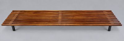 a wooden bench that is sitting on a table