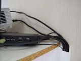 a black cable connected to a computer on a desk