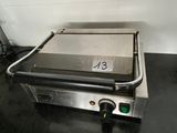 an electric grill with a number on it in a kitchen