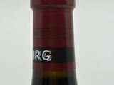 a bottle of wine that is sitting on a table