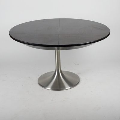 a black table with a metal base on a white background