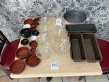 a table that has many bowls and pans on it