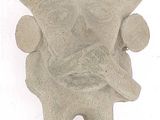 a stone statue of a man with a beard