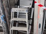 a ladder that is next to a ladder in a room