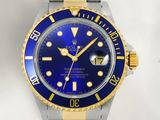 a watch with a blue face and yellow hands