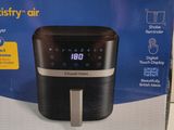an air fryer box with a digital clock on the front of it
