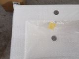 a picture of a bathroom sink that is wrapped in bubble wrap