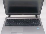 an open laptop computer sitting on top of a white table
