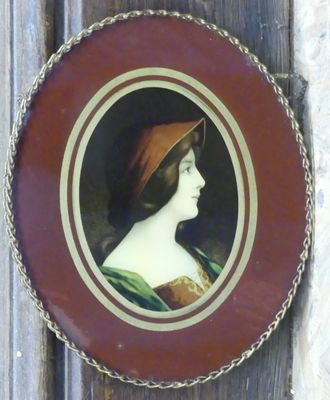 a picture of a woman with a red hat in a picture frame