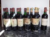 many bottles of wine lined up on the counter