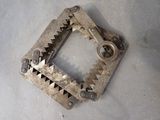 a metal object that has been made into a square shape