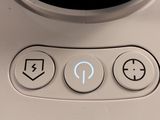 an image of a close up of a button on a toaster