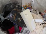 a pile of clothes and other items in a plastic bag