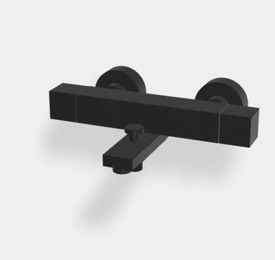un gros plan d'un objet noir sur une surface blanche