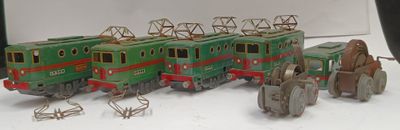 several toy trains are lined up in a row on a white surface
