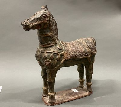a statue of a horse with a saddle on it ' s back