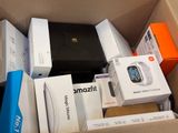 many boxes of electronic devices in a cardboard box