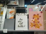 many cards on a shelf in a store