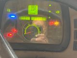 steering wheel of a vehicle with a digital display on the dashboard