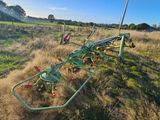 a tractor that is sitting in the middle of a field