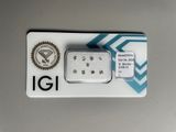 a small white diamond in a box on a table