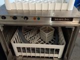 an image of a dishwasher with a basket in it