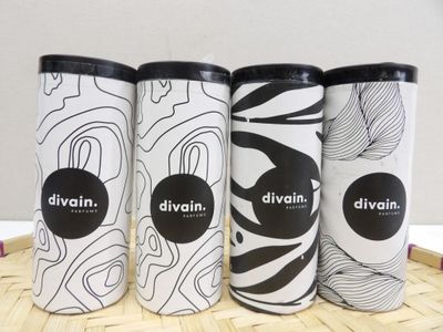 three different types of divinin coffee cups sitting on a bamboo mat