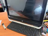 a laptop computer sitting on top of a wooden desk