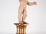 an image of a statue of a child on a pedestal