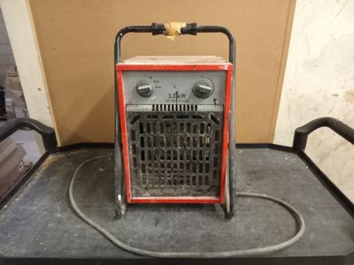 a small portable heater sitting on top of a table