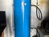 a large blue water tank sitting in the middle of a room