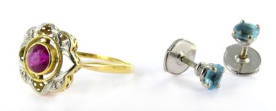 two rings and a pair of earrings are shown on a white surface