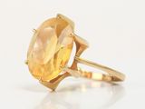 an image of a yellow gold ring with a large citrine stone