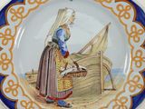 a plate with a picture of a woman on it