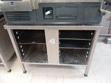 two ovens that are sitting on top of a table