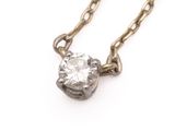 a close up of a diamond on a chain on a white background