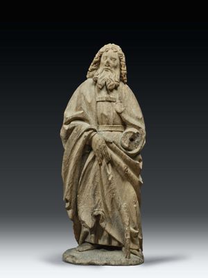 a statue of a man in a robe holding a book