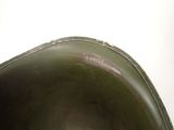 a close up of a metal bowl on a table
