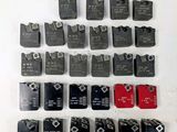 a close up of a bunch of electrical switches on a white surface