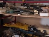 a surfboard sitting on top of a shelf in a garage