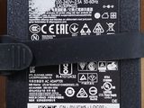 a black power supply that is attached to the back of a laptop