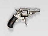 an old silver revolver with a black handle on a white background