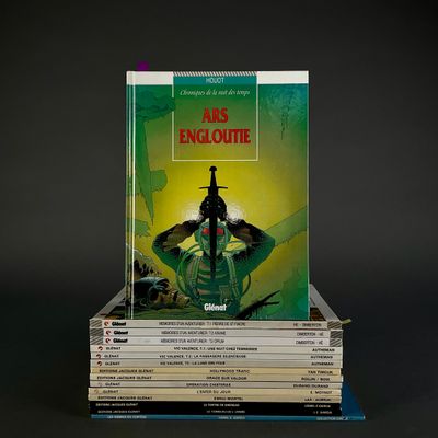 books stacked on top of each other on a black surface