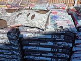 a lot of bags of food sitting on the ground