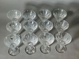many empty wine glasses sitting on a table