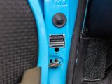 a close up of a blue door handle on a car