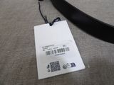 a black belt with a white tag on it